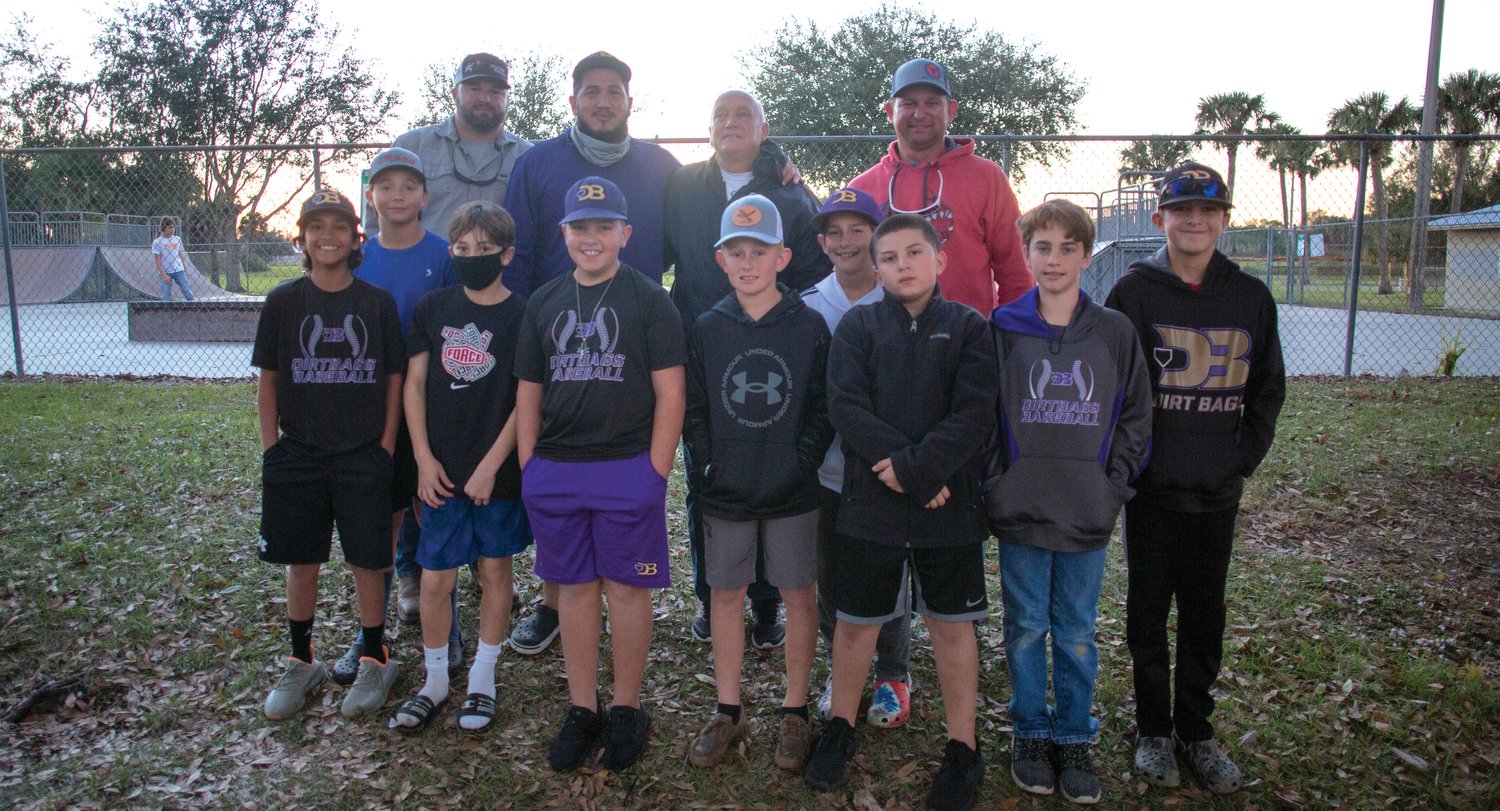 Chobee Dirtbag players and coaching staff are pictured with umpire Darrell Croft (at rear center).